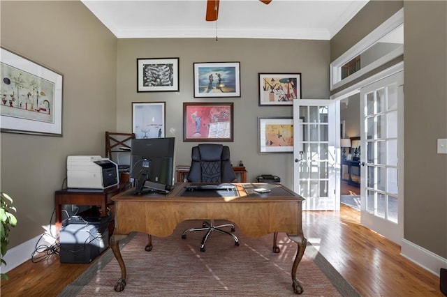 home office featuring ornamental molding, hardwood / wood-style floors, ceiling fan, and french doors