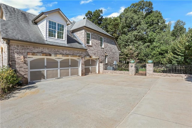 view of side of home with a garage