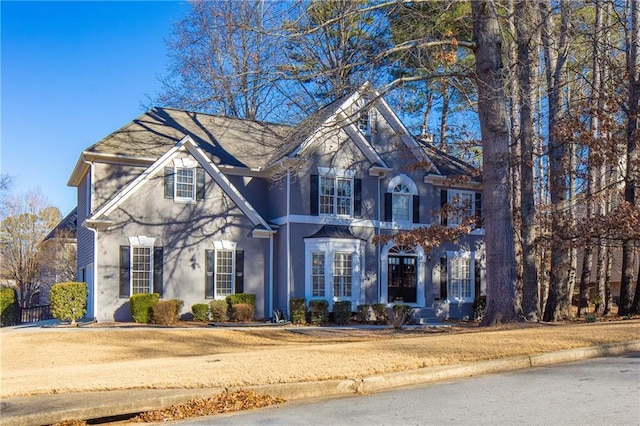 view of front of property with french doors and stucco siding