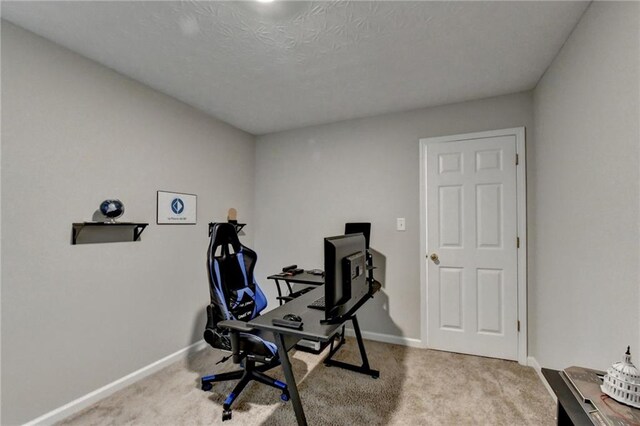 interior space featuring a textured ceiling and carpet flooring