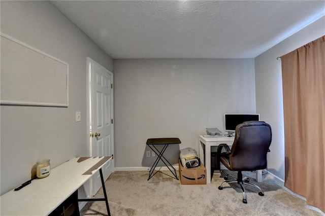 office area featuring light carpet