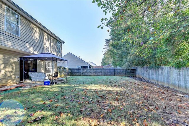 view of yard featuring a patio and a gazebo