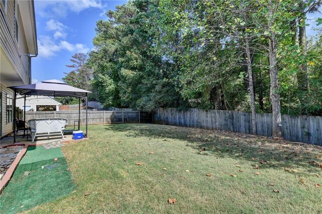 view of yard featuring a patio and a gazebo