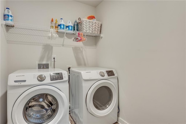 laundry area featuring washing machine and clothes dryer