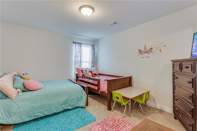 bedroom featuring light carpet