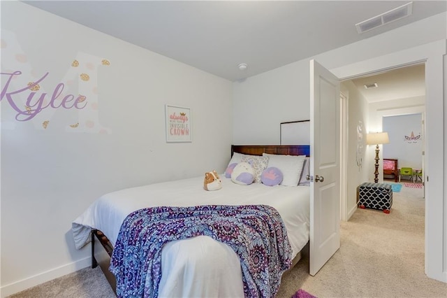 bedroom featuring light carpet