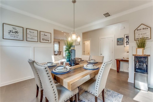 dining room with a chandelier and dark hardwood / wood-style flooring