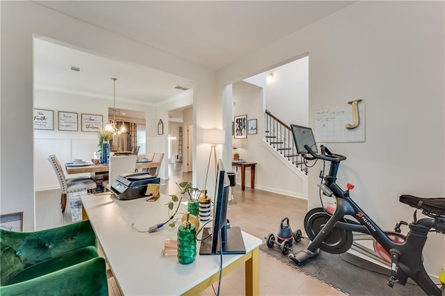 interior space featuring a notable chandelier and ornamental molding