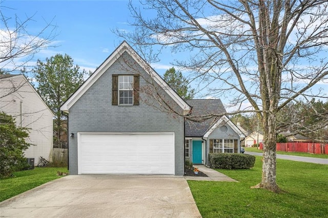 traditional-style house with a garage, brick siding, fence, concrete driveway, and a front lawn