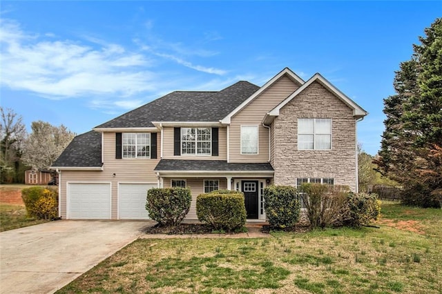 view of front of property with stone siding, a garage, driveway, and a front lawn