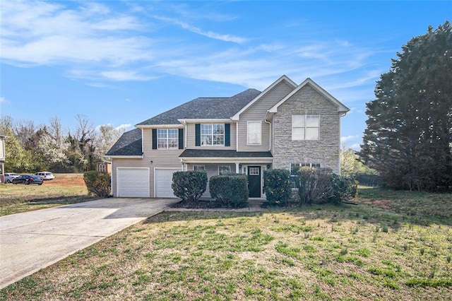 traditional-style house with a front yard, an attached garage, stone siding, and driveway