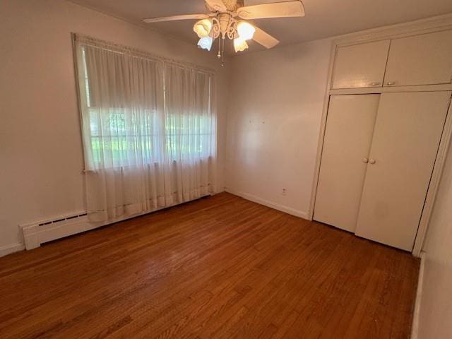 95 Jones St, Dahlonega, GA 30533 - unfurnished bedroom with wood finished floors, a closet, and ceiling fan