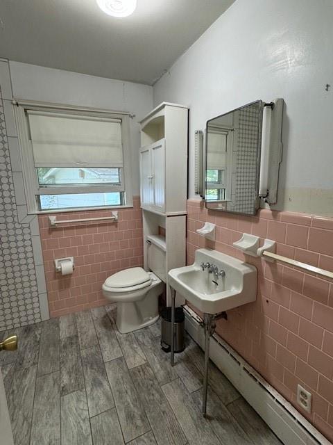 95 Jones St, Dahlonega, GA 30533 - bathroom featuring tile walls, wood finished floors, and a wainscoted wall
