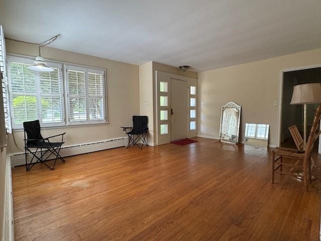 95 Jones St, Dahlonega, GA 30533 - foyer entrance featuring wood finished floors and a baseboard radiator