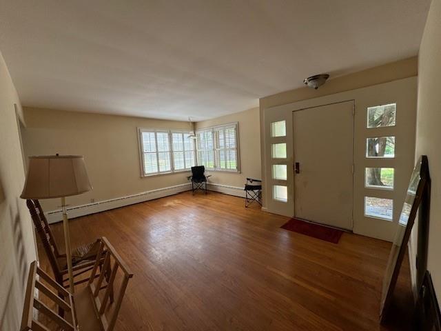 95 Jones St, Dahlonega, GA 30533 - entrance foyer featuring a baseboard heating unit and wood finished floors