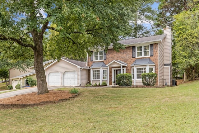 colonial house with a garage, a front yard, and central air condition unit