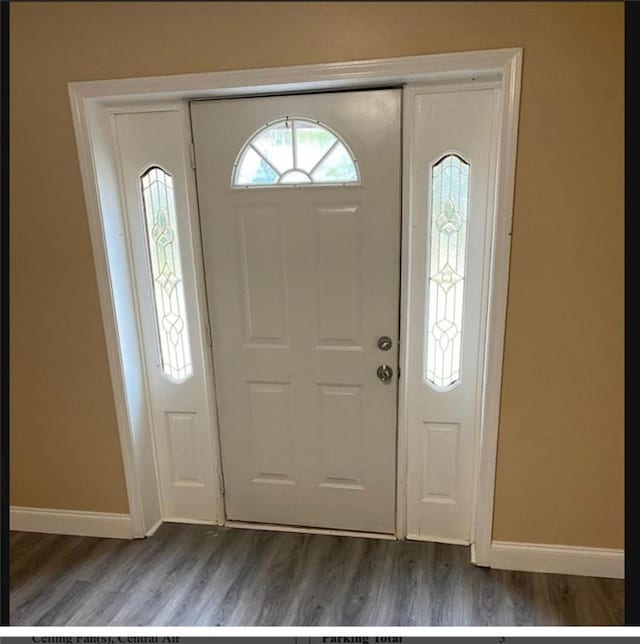 foyer with dark hardwood / wood-style floors