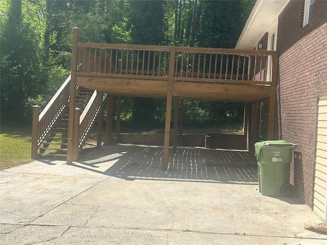 view of gate with a wooden deck