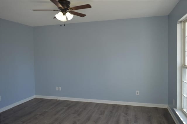 empty room with dark hardwood / wood-style floors and ceiling fan