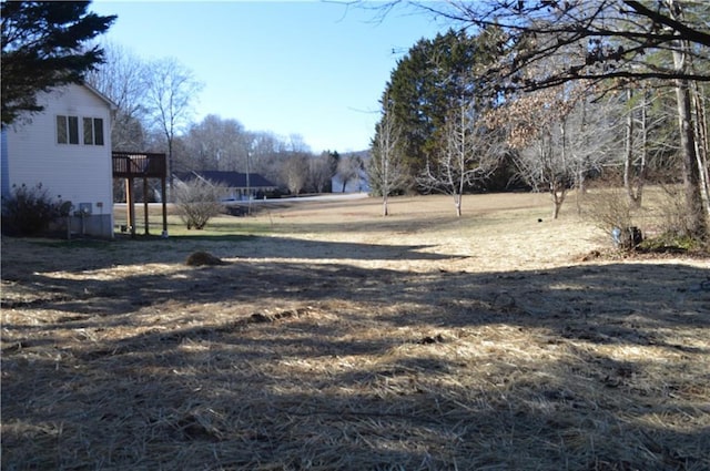 view of yard with a wooden deck