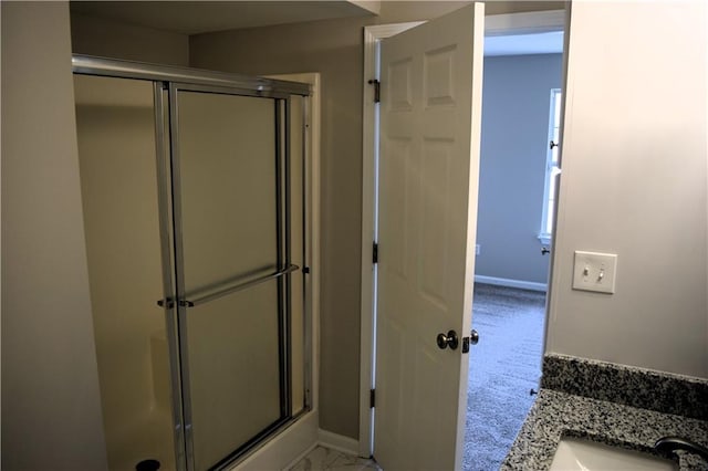 253 Woodland Way, Canton, GA 30114 - full bathroom with a sink, a stall shower, and baseboards