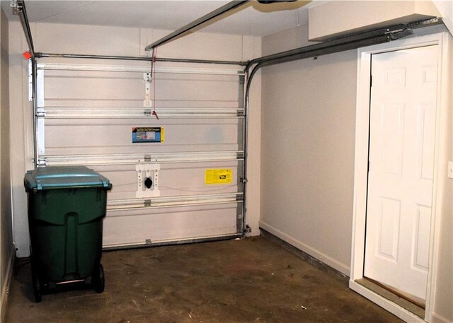 253 Woodland Way, Canton, GA 30114 - garage featuring baseboards