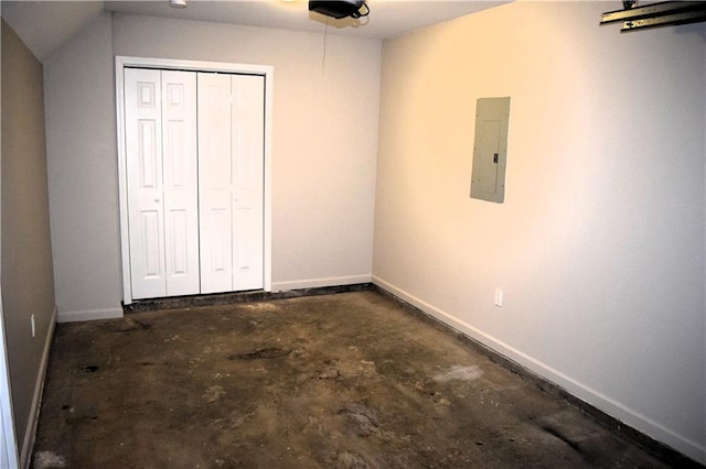 253 Woodland Way, Canton, GA 30114 - unfurnished bedroom featuring electric panel, baseboards, a closet, and concrete floors