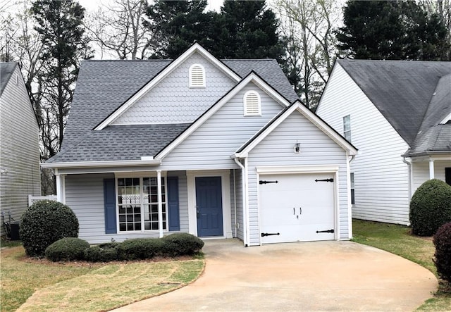 253 Woodland Way, Canton, GA 30114 - view of front of property with cooling unit, driveway, a shingled roof, and an attached garage