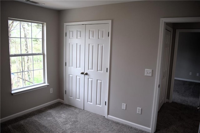 253 Woodland Way, Canton, GA 30114 - unfurnished bedroom featuring baseboards, carpet floors, visible vents, and a closet
