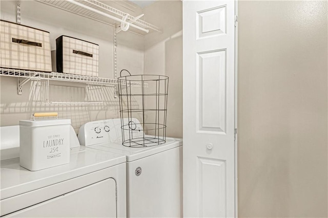 laundry area with laundry area and separate washer and dryer