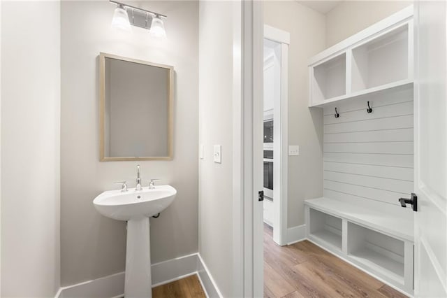 bathroom with hardwood / wood-style flooring and sink