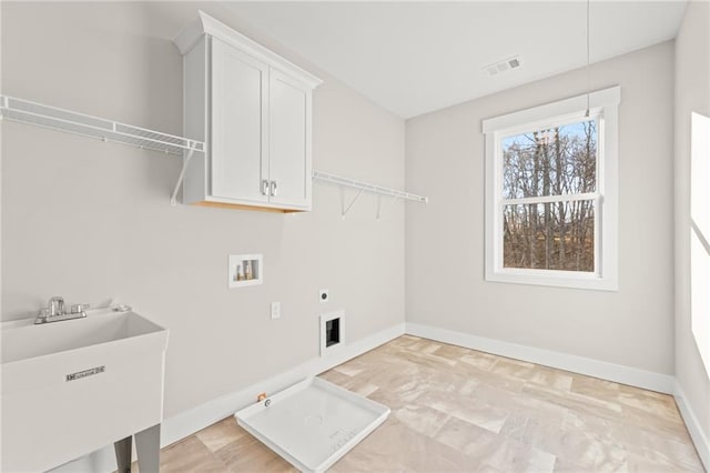 laundry room with cabinets, hookup for a gas dryer, sink, washer hookup, and hookup for an electric dryer