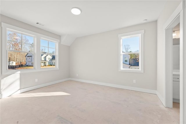 interior space featuring a healthy amount of sunlight and lofted ceiling