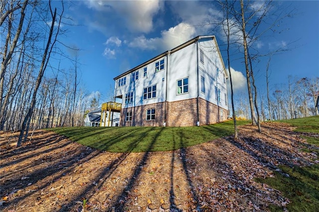 rear view of property featuring a yard