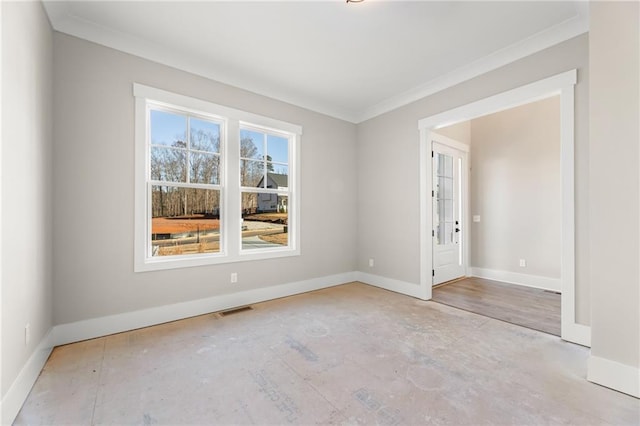 empty room featuring crown molding