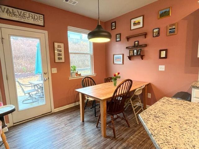 dining room featuring dark hardwood / wood-style flooring