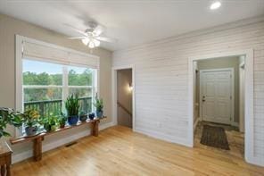 interior space with ceiling fan and wood-type flooring