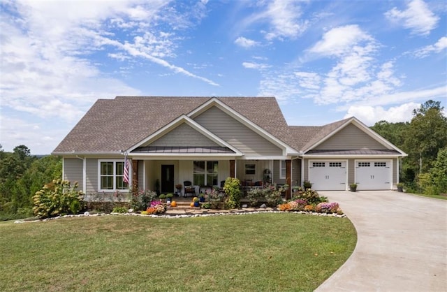 craftsman-style home featuring a front yard, a porch, and a garage