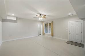 interior space featuring ceiling fan