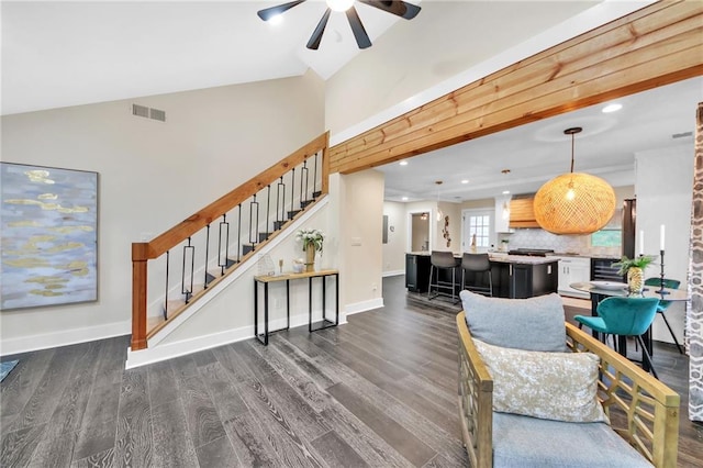 living room with wine cooler, ceiling fan, dark hardwood / wood-style flooring, and vaulted ceiling