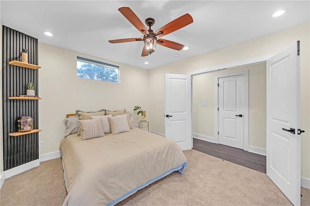 carpeted bedroom featuring ceiling fan