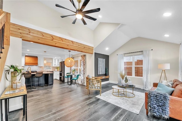 living room with ceiling fan, dark hardwood / wood-style floors, and vaulted ceiling