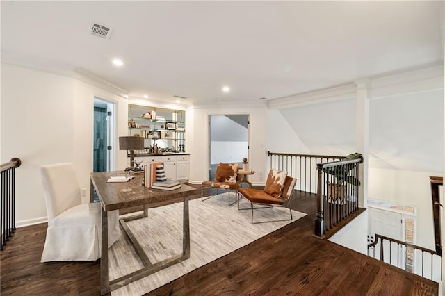 interior space featuring visible vents, dark wood finished floors, crown molding, and recessed lighting