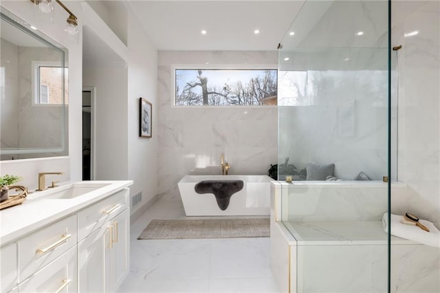 full bathroom with visible vents, a soaking tub, marble finish floor, vanity, and recessed lighting