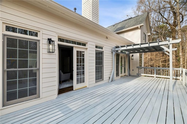 wooden terrace with a pergola