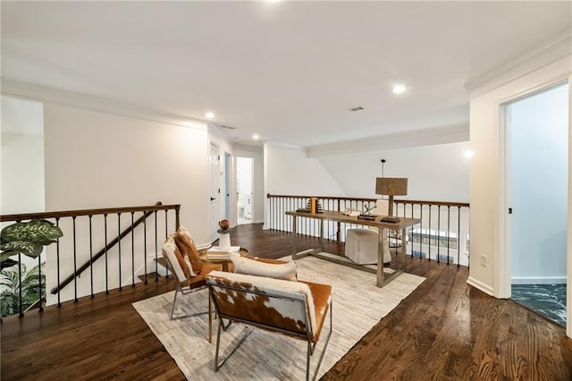 living area featuring crown molding, wood finished floors, and recessed lighting