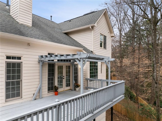 wooden terrace with french doors and a pergola