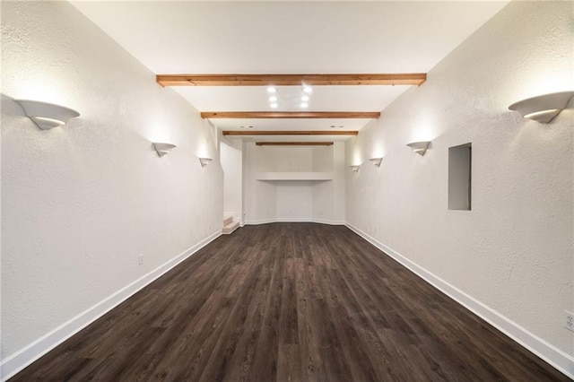 below grade area featuring baseboards and wood finished floors