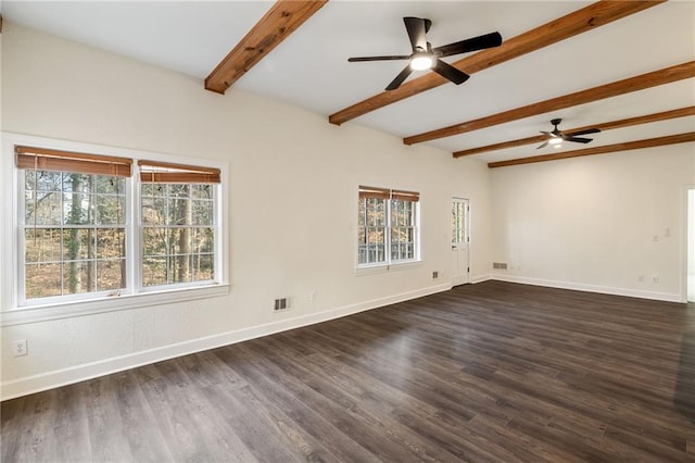 unfurnished room with beam ceiling, visible vents, dark wood finished floors, and baseboards