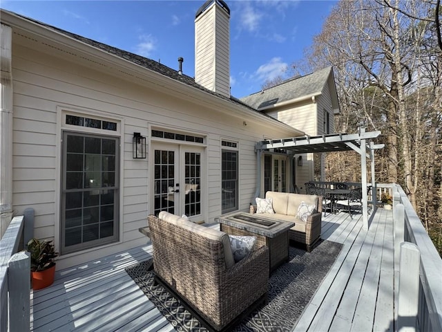 wooden terrace featuring an outdoor hangout area, french doors, outdoor dining area, and a pergola